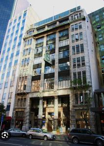 a large building with a clock on the front of it at Heart of The City in Auckland