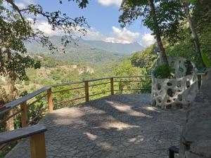 a balcony with a view of a valley at Casa Musgo in Xilitla