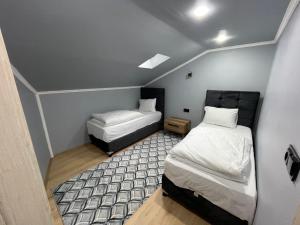 Postel nebo postele na pokoji v ubytování adora apart