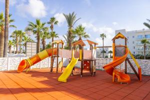 a playground with colorful slides on a patio at Papantonia Hotel in Protaras