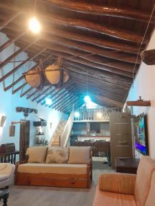 a living room with a couch and a table at Casa rural Cerro Campón in Carmona