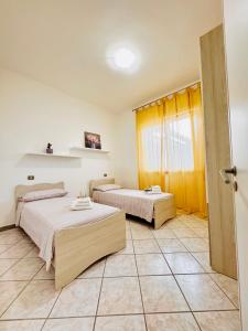 A bed or beds in a room at Casa Vacanze Mareblù