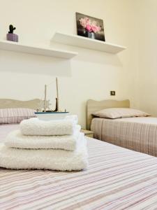 A bed or beds in a room at Casa Vacanze Mareblù