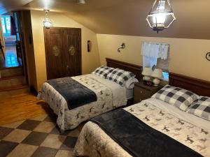 Ένα ή περισσότερα κρεβάτια σε δωμάτιο στο Chez Odette, suite international