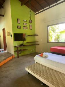 Postel nebo postele na pokoji v ubytování Vila Feliz Arraial + 29 fotografií