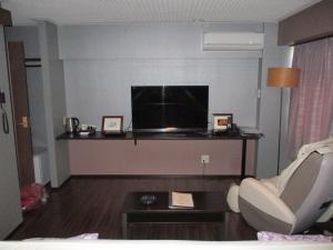 TV a/nebo společenská místnost v ubytování Town Hotel 41