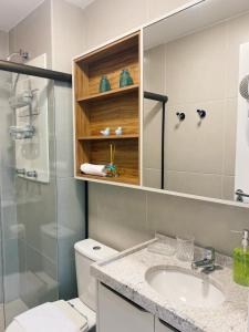 a bathroom with a toilet and a sink and a shower at Sunny Hall - Porto de Galinhas in Porto De Galinhas +10 photos