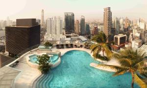 a large swimming pool on the top of a building at InterContinental Bangkok by IHG in Bangkok