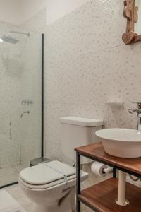 a bathroom with a toilet and a sink at Cajón de Agua in Cafayate
