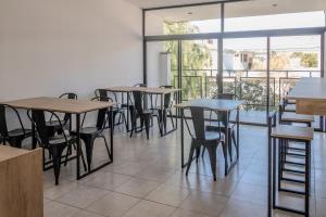 a row of tables and chairs in a restaurant at Cajón de Agua in Cafayate