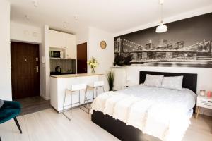 Posteľ alebo postele v izbe v ubytovaní PiotrApartments - Big City Life Apartments in Central Warszawa
