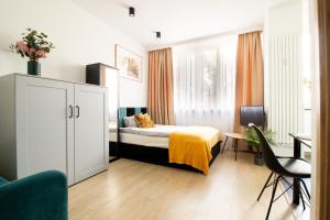 Posteľ alebo postele v izbe v ubytovaní PiotrApartments - Big City Life Apartments in Central Warszawa