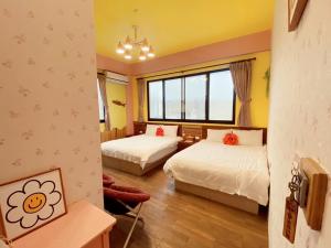 Letto o letti in una camera di Big Fish Homestay