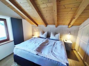 Ένα ή περισσότερα κρεβάτια σε δωμάτιο στο Alpenliebe Comfortable holiday residence +16 φωτογραφίες