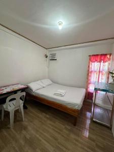 Postel nebo postele na pokoji v ubytování Bearby Siargao Homestay by RedDoorz