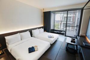 Katil atau katil-katil dalam bilik di Orient Luxury Hotel-Jiaoxi