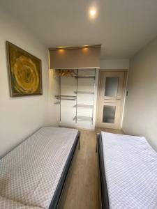 Postel nebo postele na pokoji v ubytování Omega Apartment