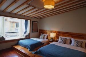 Postel nebo postele na pokoji v ubytování Dali Yunxi Boutique Inn