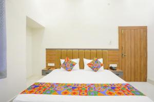 Postel nebo postele na pokoji v ubytování Via Downtown Residency