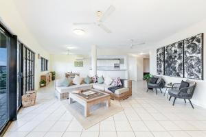 A seating area at Oceanview Tropical - A Top End Poolside Oasis
