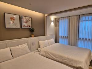 Postel nebo postele na pokoji v ubytování The solid residence - Elbon the stay by haeundae