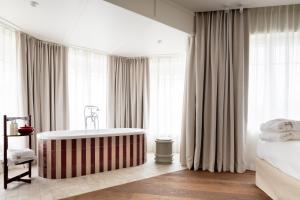 Postel nebo postele na pokoji v ubytování Hotel Villa Bonnie