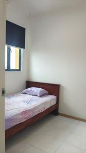 a bedroom with a bed in a room at SAFIYA Homestay Vista Alam in Shah Alam