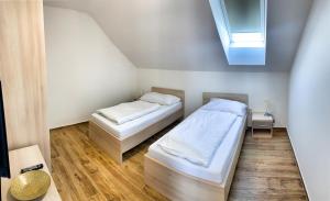 Postel nebo postele na pokoji v ubytování Apartmánové domy Lipno 1