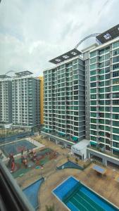 an aerial view of a large building with two pools at SAFIYA Homestay Vista Alam in Shah Alam +18 photos
