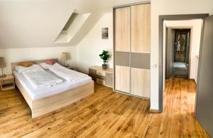 Postel nebo postele na pokoji v ubytování Apartmánové domy Lipno 1
