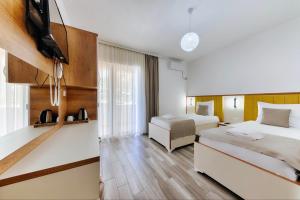 Postel nebo postele na pokoji v ubytování Hotel ŠARS