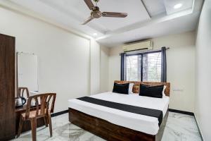 Postel nebo postele na pokoji v ubytování Super Hotel O Swagatam Hotel