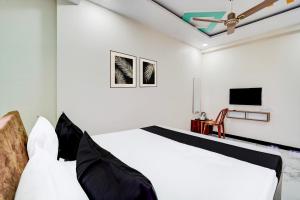 Ένα ή περισσότερα κρεβάτια σε δωμάτιο στο Super Hotel O Swagatam Hotel