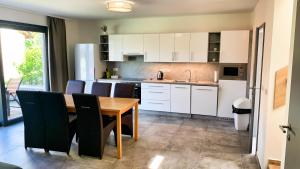 Kuchyň nebo kuchyňský kout v ubytování Apartmánové domy Lipno 1