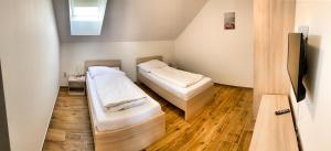 Postel nebo postele na pokoji v ubytování Apartmánové domy Lipno 1