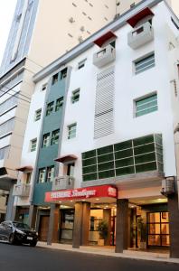 a building with a car parked in front of it at Presidente Boutique in Guayaquil