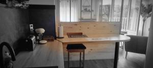 a wooden desk in a room with a window at Bayard la tour in Charleville-Mézières
