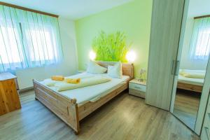 a bedroom with a bed with two teddy bears on it at Huberhof 1 by Alpenidyll Apartments in Rohrmoos