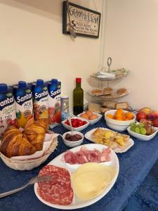 a table with many plates of food on it at Casa Famiani Bed & Breakfast in Letojanni