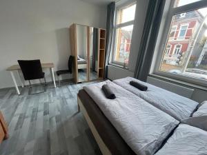 Postel nebo postele na pokoji v ubytování Schönes einfaches zentrales Zimmer in Oldenburg