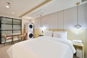 Rubato Hotel Ulsan Junggu客房内的一张或多张床位
