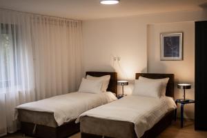 Postel nebo postele na pokoji v ubytování Brodnik Apartment