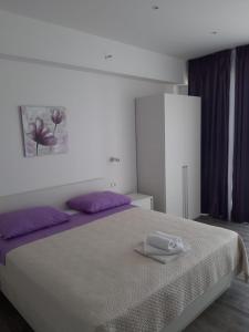 Postel nebo postele na pokoji v ubytování Apartmani Marija Mljet