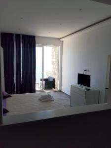 TV a/nebo společenská místnost v ubytování Apartmani Marija Mljet