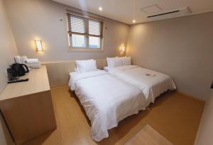 Postel nebo postele na pokoji v ubytování Hotel razaB