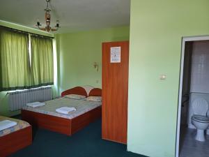 Postel nebo postele na pokoji v ubytování Интернационал