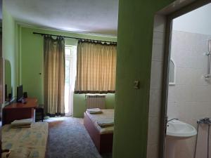 Postel nebo postele na pokoji v ubytování Интернационал + 3 fotografie