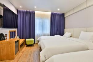 Postel nebo postele na pokoji v ubytování Hotel Langsam