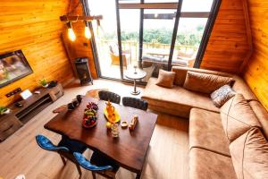 a living room with a couch and a table at Galaxy Bungalow in Trabzon