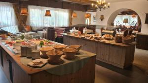 a buffet line with food on display in a restaurant at Hotel Donnerhof in Fulpmes